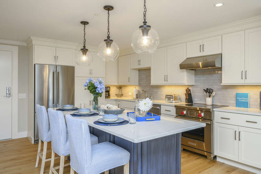 Luxury style Kitchen with stainless appliances , chefs  oven and large center island with seating for 3. Unit 204, 557 Route 28 Harwich Port Cape Cod New England Vacation Rentals