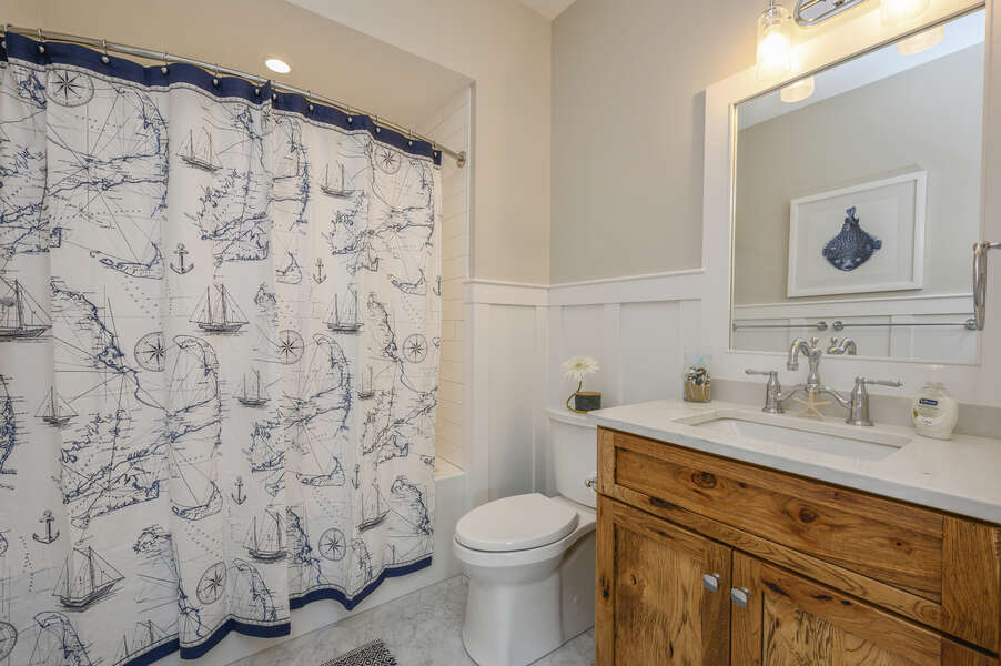 Bathroom #2 off the hallway with shower tub combo in nautical decor. Unit 204, 557 Route 28, Harwich Port, Cape Cod, New England Vacation Rentals