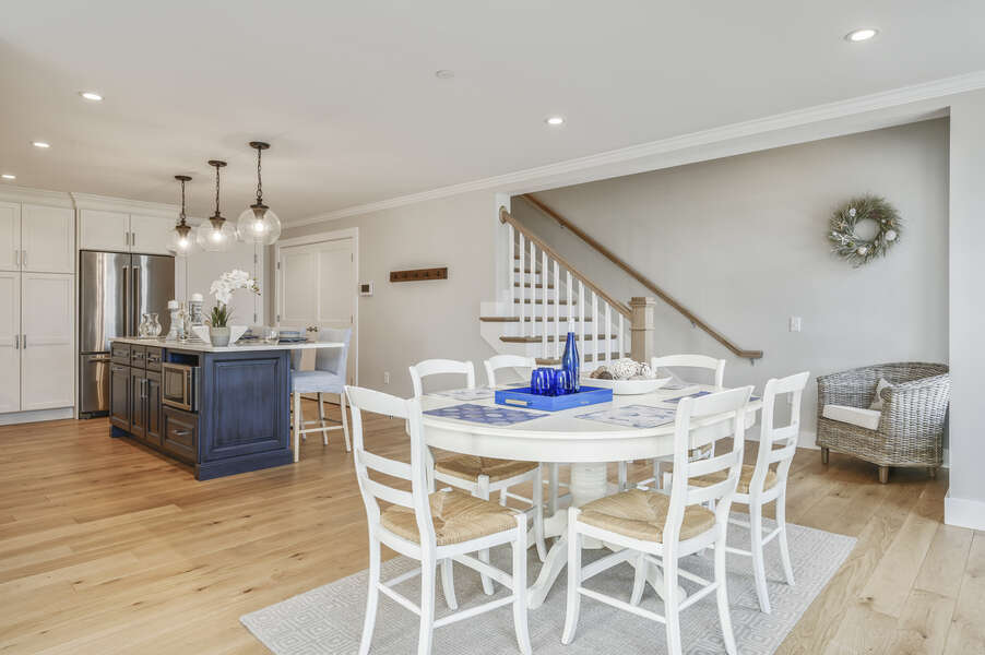 Open Concept Kitchen and dining with seating for 6 and entrance to second level. Unit 203, 557 Route 28, Harwich Port, Cape Cod, New England Vacation Rentals