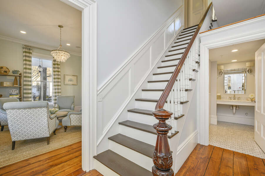 The main staircase is just inside the front door, and a large half bath off the entry. 525 Route 28, Harwich Port, Cape Cod, New England Vacation Rentals #