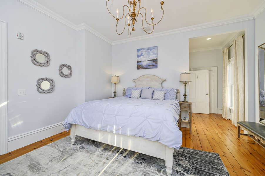 The Charleston bedroom with plush King size bed, high ceilings, floor to ceiling windows, and ensuite bathroom. 525 Route 28, Harwich Port, Cape Cod, New England Vacation Rentals #BookNEVRDirectTheMooring
