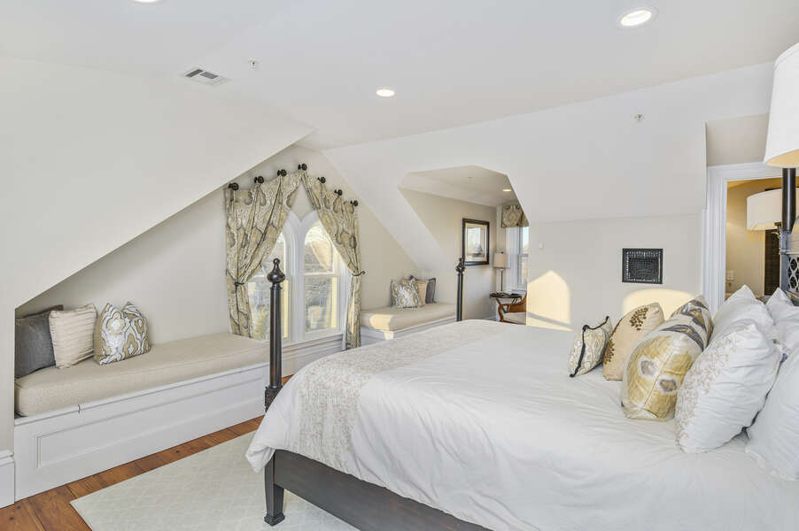 The Nantucket bedroom located on the 3rd floor, has a King sized bed, seating under the eaves on either side of the window, and ensuite bathroom. 525 Route 28, Harwich Port, Cape Cod, New England Vacation Rentals