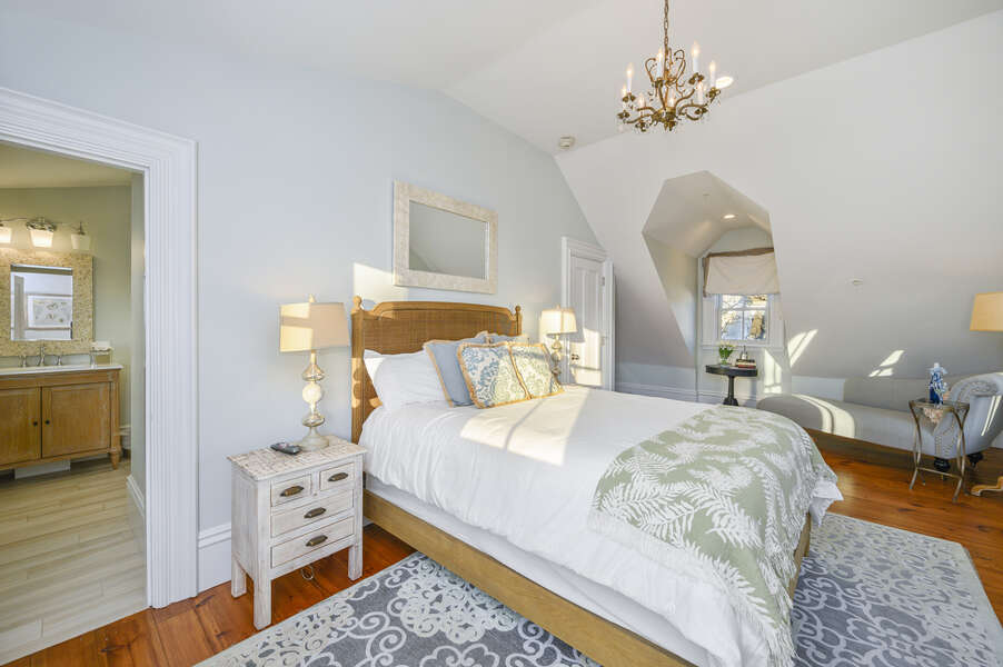 The Newport bedroom, tucked away with separate access from the staircase off the kitchen. Queen bed and ensuite bath. 525 Route 28, Harwich Port, Cape Cod, New England Vacation Rentals