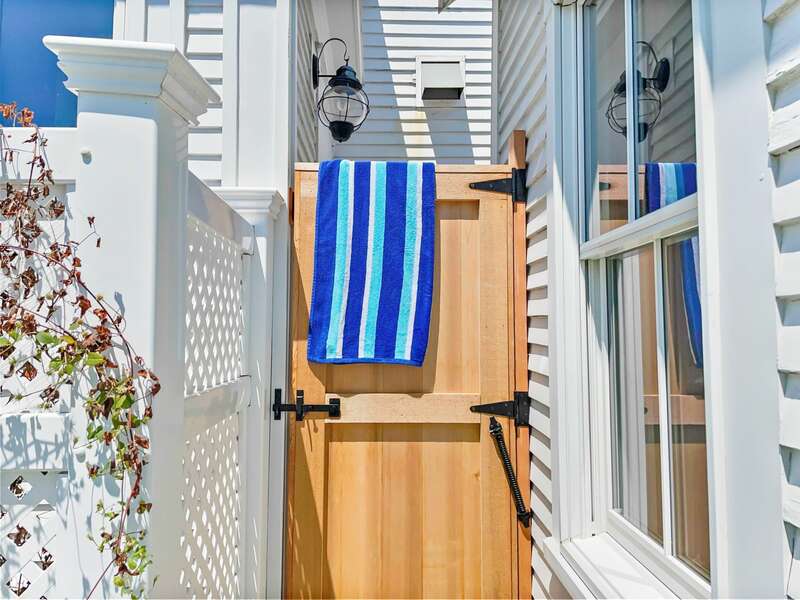 Past the grilling/dining area, you will find the outdoor shower tucked into a private alcove - 525 Route 28, Harwich Port, Cape Cod, New England Vacation Rentals