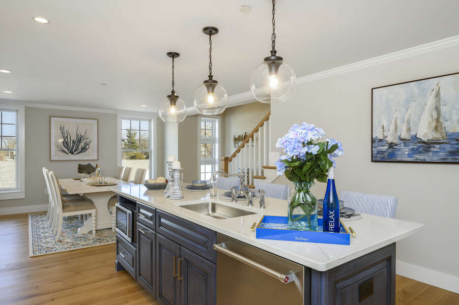 Luxurious open concept Kitchen with center island, seating for 3 at the bar, dishwasher and microwave. Unit 201, 557 Route 28 Harwich Port, Cape Cod, New England Vacation Rentals
