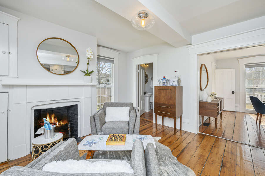 Sitting area with mini bar and 1/2 bath and original non-working fireplace is just off the kitchen. 530 Route 28 Harwich Port, Cape Cod, New England Vacation Rentals