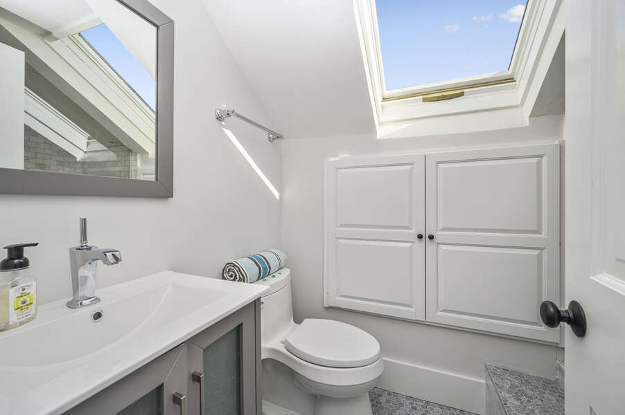 En-suite bath to bedroom #2 has vanity and large step shower with skylight and built in cabinets. 530 Route 28 Harwich Port, Cape Cod, New England Vacation Rentals