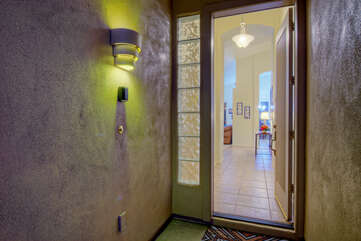Front door and entrance foyer welcome you to our cozy 3 BR, 2 BA home in quiet setting.