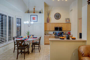 Great room opens into the kitchen that is well stocked to ensure meal preps are effortless.