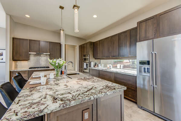 Plenty of Gorgeous Granite Counters and Custom Cabinetry