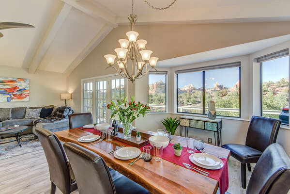 Bay Windows Bring in Natural Light and Panoramic Red Rock Views into Both the Family and Dining Rooms