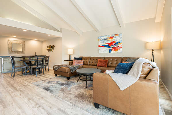 Adjacent to the Breakfast Area is the Family Room with a Large Sectional Sofa, 65