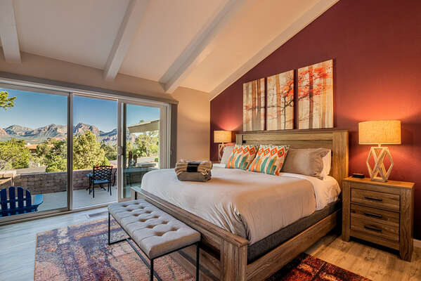 Enjoy the Open and Bright Master Bedroom with a Vaulted Ceiling and Take in the Views from Inside or Out on the Patio