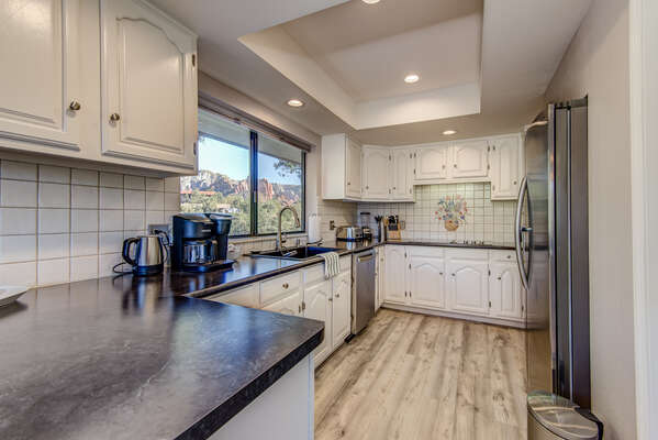 Remodeled and Fully Equipped Kitchen with Ample Counter Space for Meal Prep and Entertaining