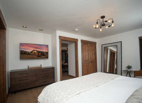 Main level master bedroom with attached private bathroom