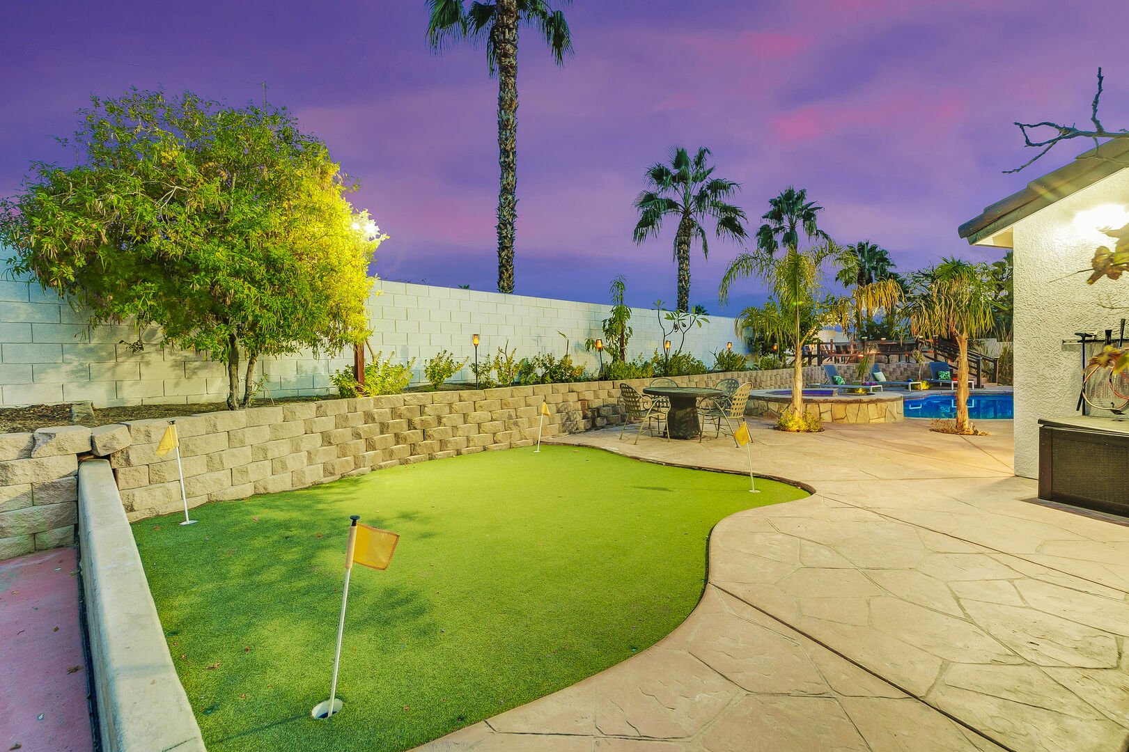 The second putting green just behind the pool features 4 holes!