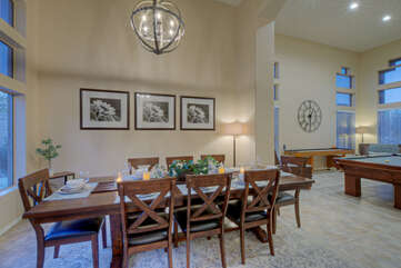 The formal dining area adjoins the kitchen and game room.