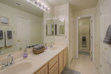 Second bathroom has dual vanity sinks and a walk-in shower.