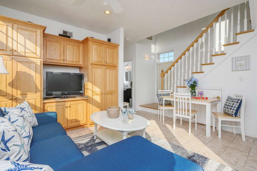 Living room Flat screen tv and large cabinet with games and storage table for extra seating or games. 27 Fiddlers Green Lane-Dennis Port-New England Vacation Rentals