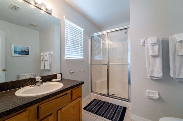 Master Bath showing shower and sink.