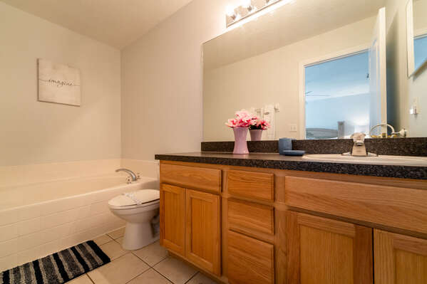 En-Suite Bath for bedroom 2 Showing tub, toilet and sink vanity