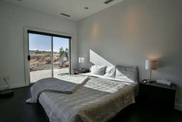 Master bedroom with an entrance to the patio