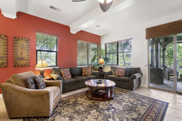 Sofas, Armchair, Ceiling Fan, and Sliding Doors to the Lanai
