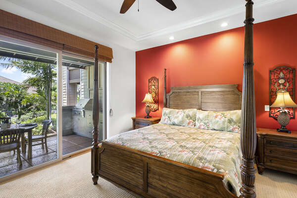Bedroom with Sliding Doors to the Lanai, Large Bed, and Ceiling Fan