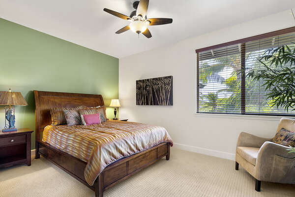 Bedroom with Large Bed, Armchair and Ceiling Fan