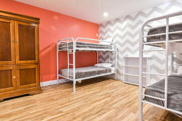 Extra sleeping area with three twin bunkbeds and four roll-away beds.
