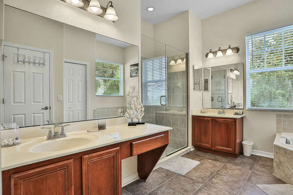 The large ensuite bathroom has a garden tub and walk-in shower