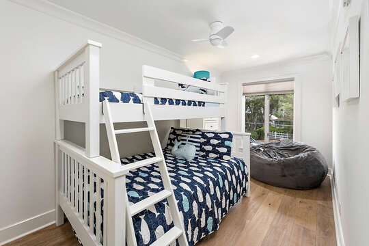 Bedroom with twin bed over full bed bunk bed