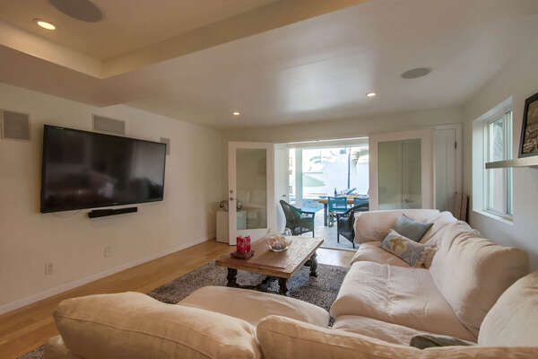 Family Room with Flat Screen TV and Access to Pool Deck - Lower Level