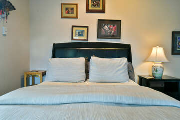 Bedroom with a queen bed and nightstand