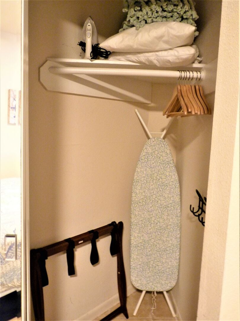 There's extra pillows, an ironing board and iron, as well as a luggage rack and coat hangers in the bedroom closet