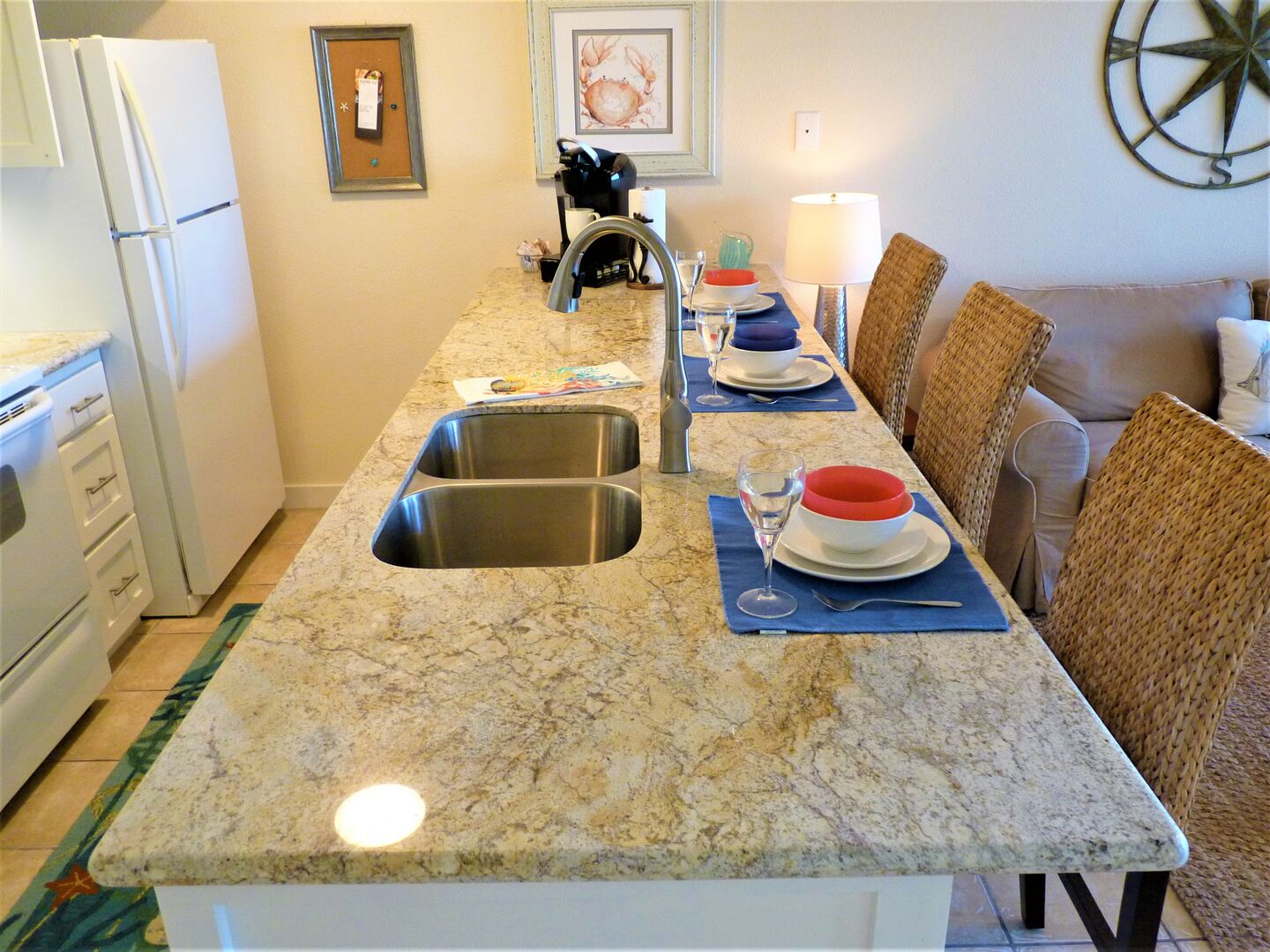 The breakfast bar has plenty of room for food prep, dining, or even a workspace