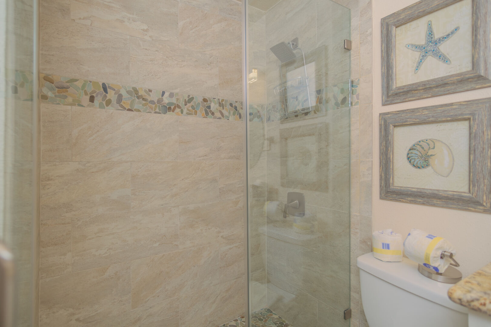 You'll truly enjoy the walk in shower with upgraded tile and shower head, absolutely divine.