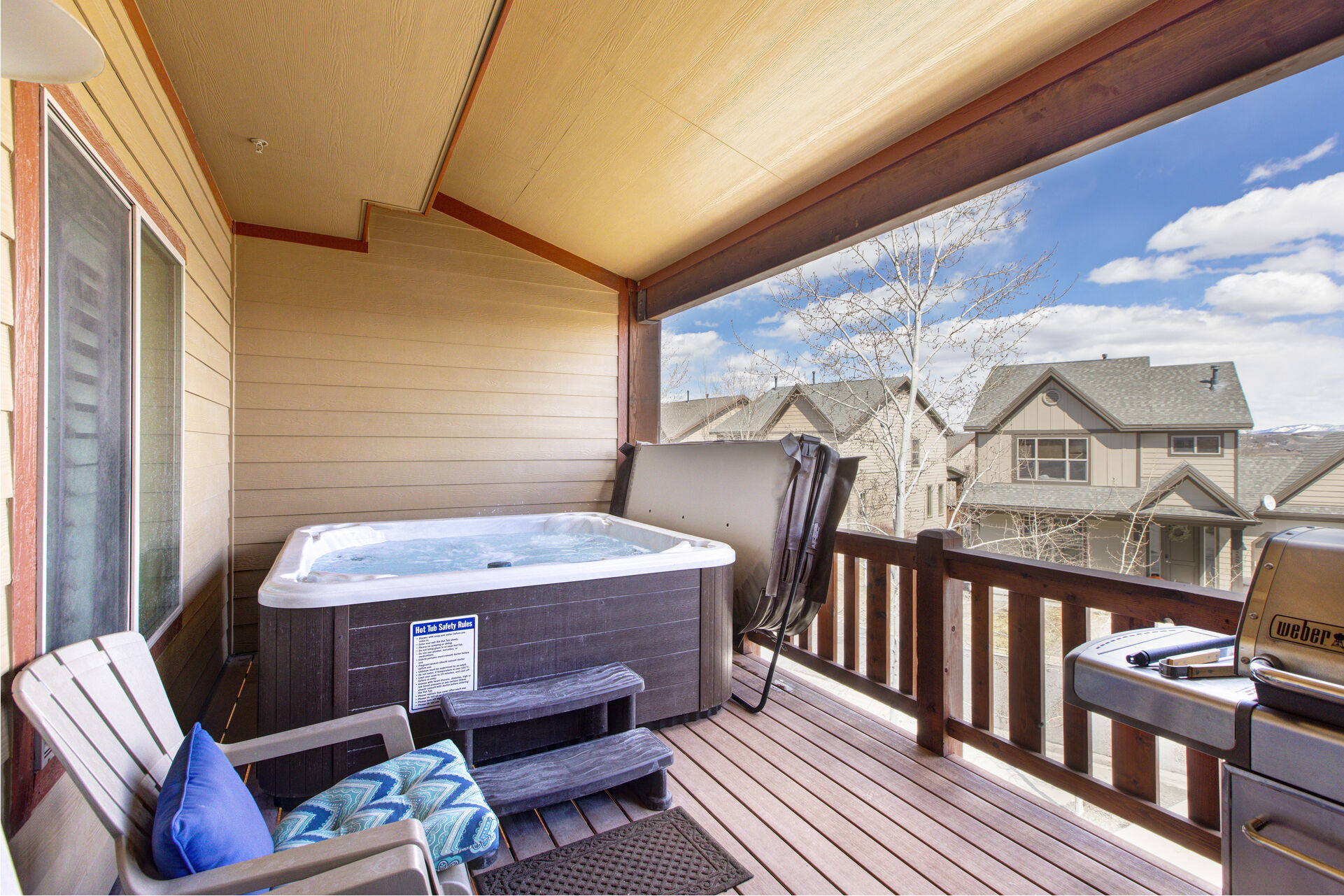 Main Level Deck with a Private 6-8 Person Hot Tub, Adirondack Chairs and a Natural Gas BBQ