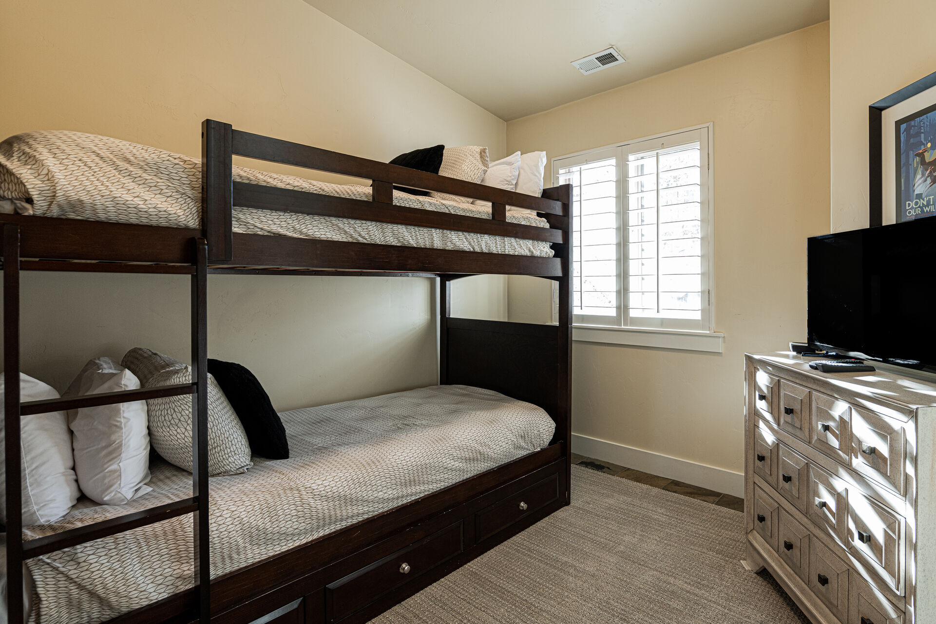Upper Level Bedroom 4 with  Twin over Twin Bunk Beds & Access to a Full Shared Bath