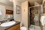 Private Bath with a Granite Counter Sink and Shower