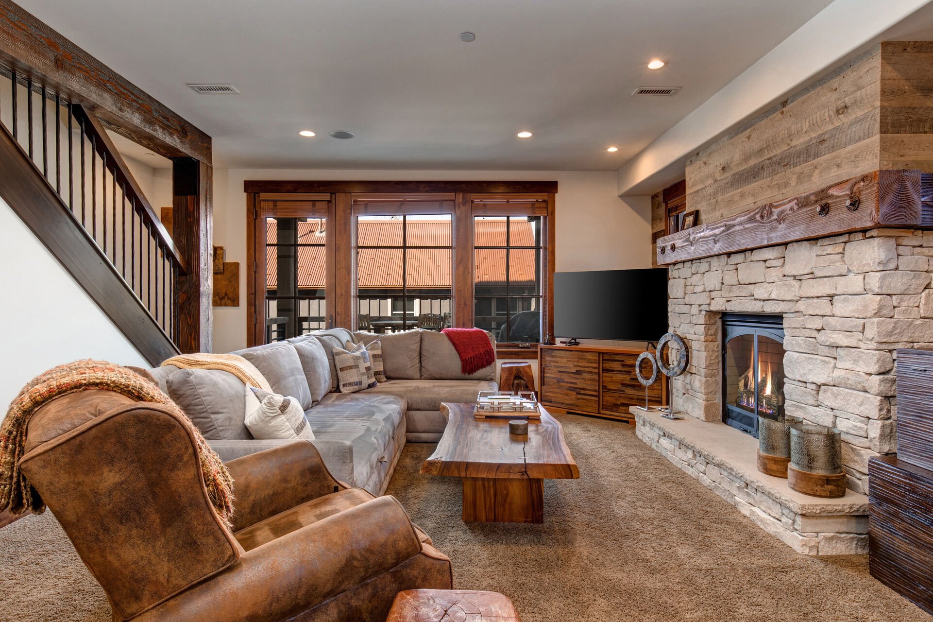 Living Room with Comfortable Furnishings, Gas Fireplace, Smart TV and Balcony Access