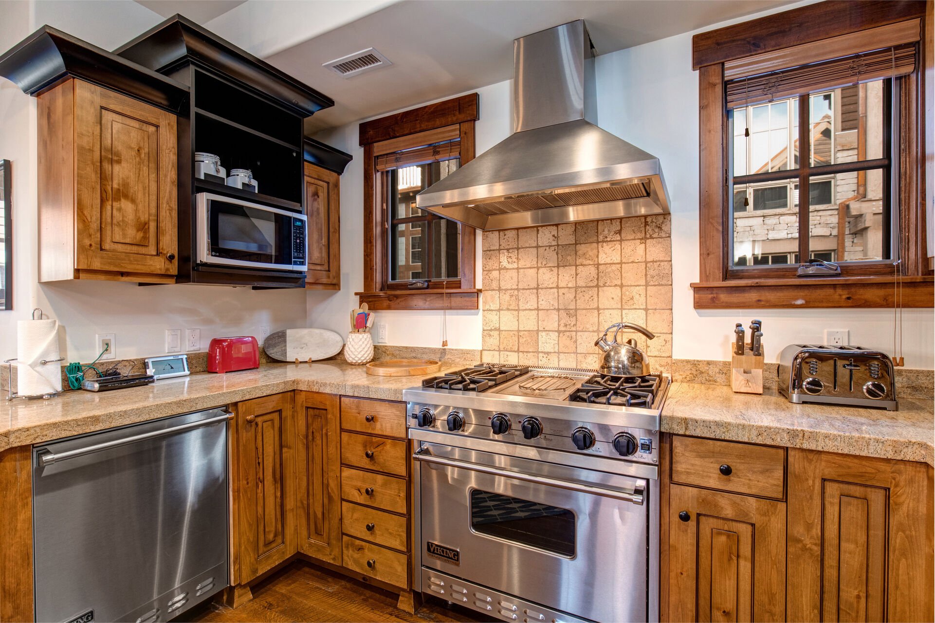 Gourmet Kitchen with Viking Stainless Steel Appliances Including a 4-Burner Gas Range with a Griddle and Convection Oven