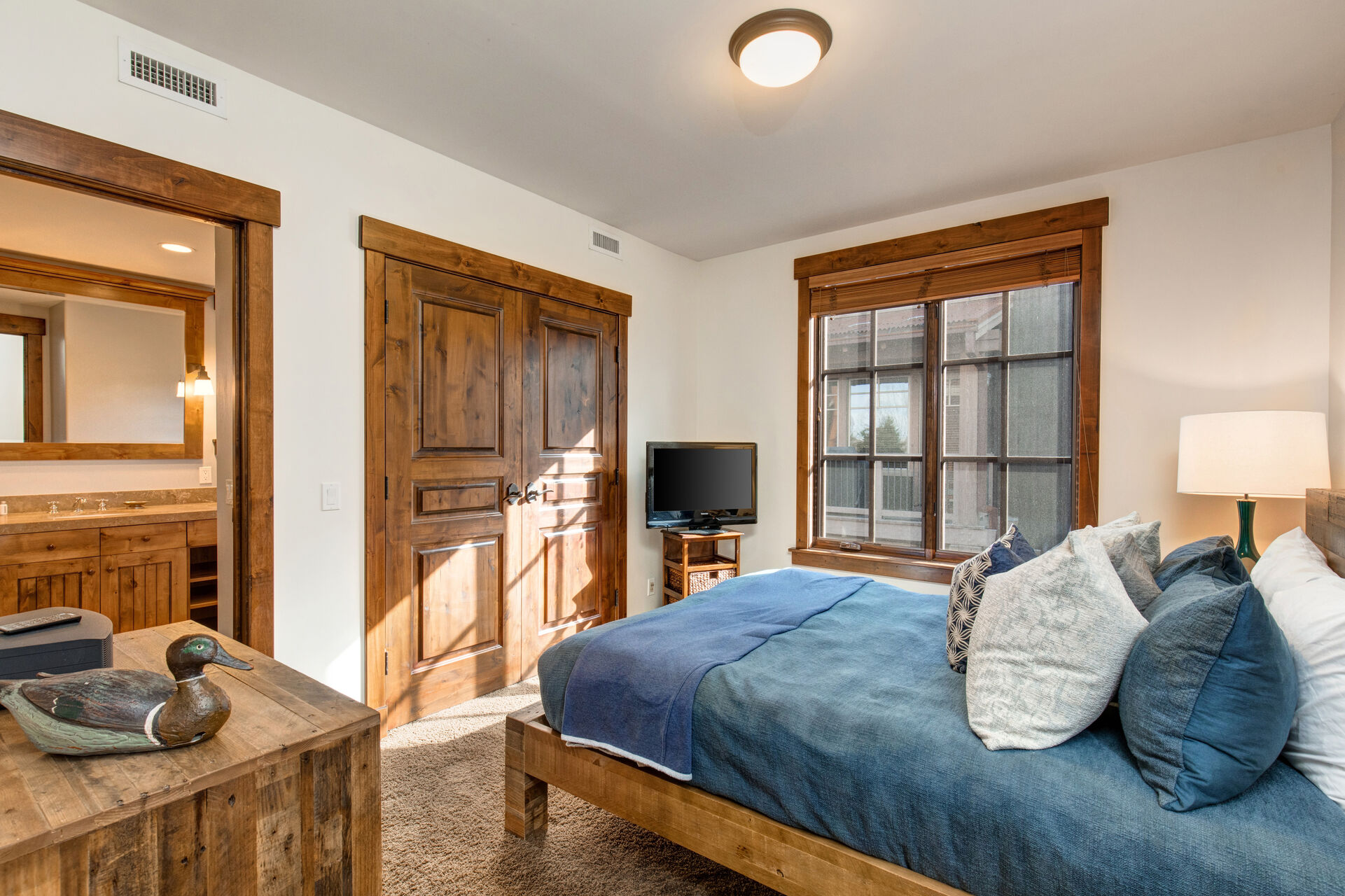 Upper Level Master Bedroom 2 with a Queen Bed, TV and Private Bath