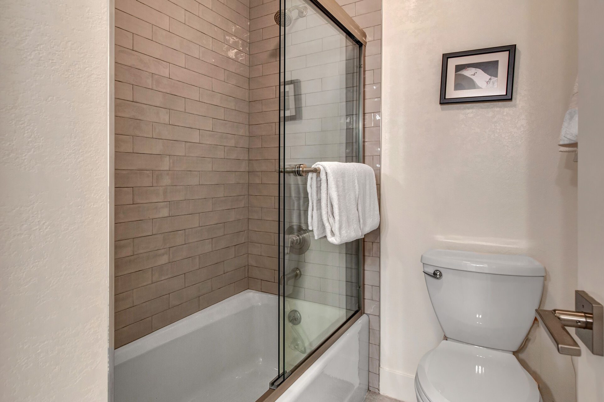 Shared full bath with tub/shower combo and private sauna