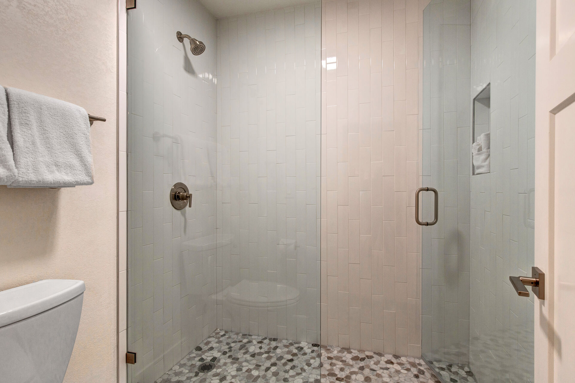Master Bathroom with dual sinks and large tiled shower