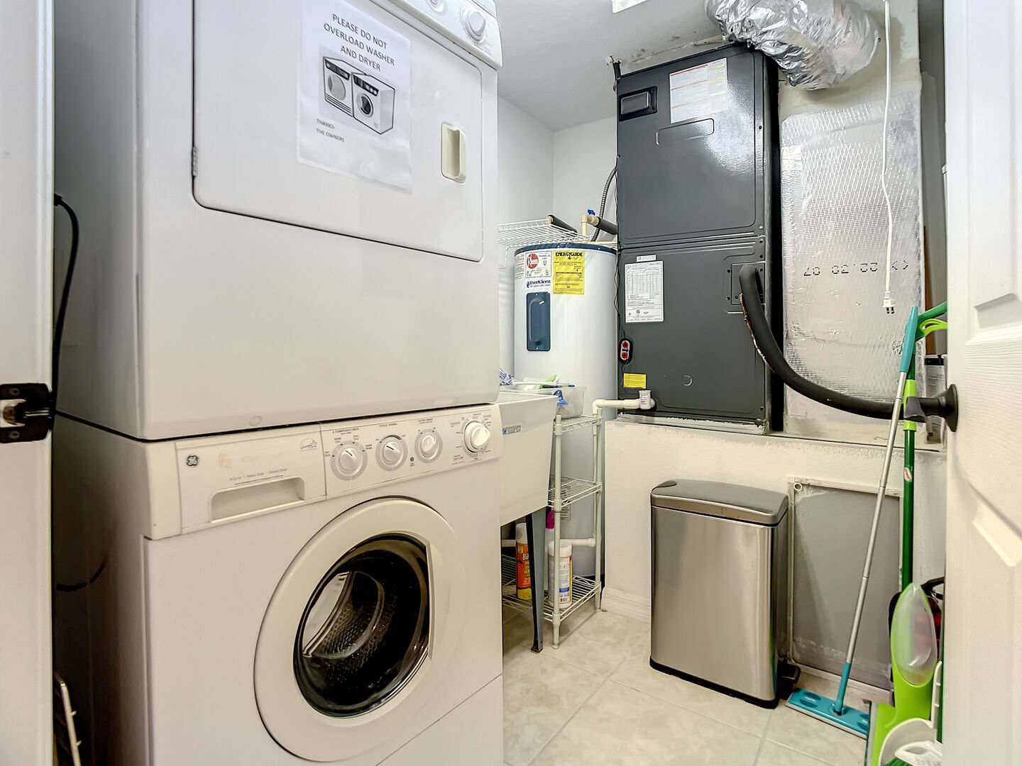 Full sized washer and dryer in the laundry room.