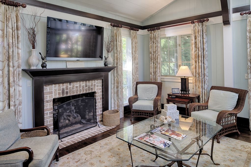 In the living room, guests can gather enjoy the HD TV and gas fireplace