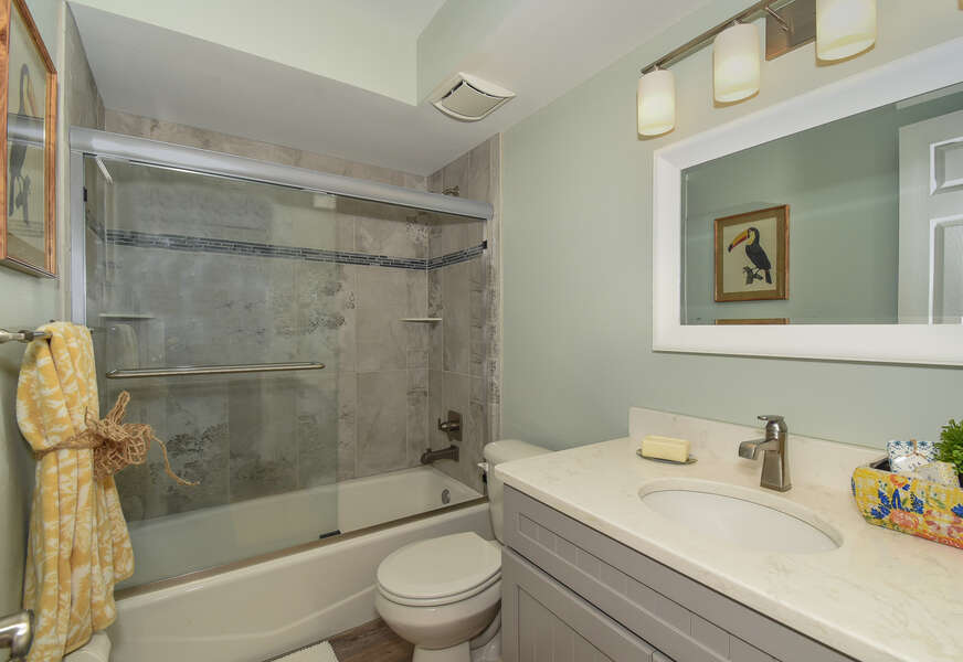 Shower-tub combo, vanity sink, and toilet