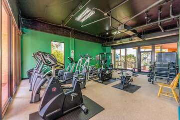 ONE OF THE MANY AMMENITIES INCLUDED AT THE RESORT IS A GYM OVERLOOKING THE GULF OF MEXICO