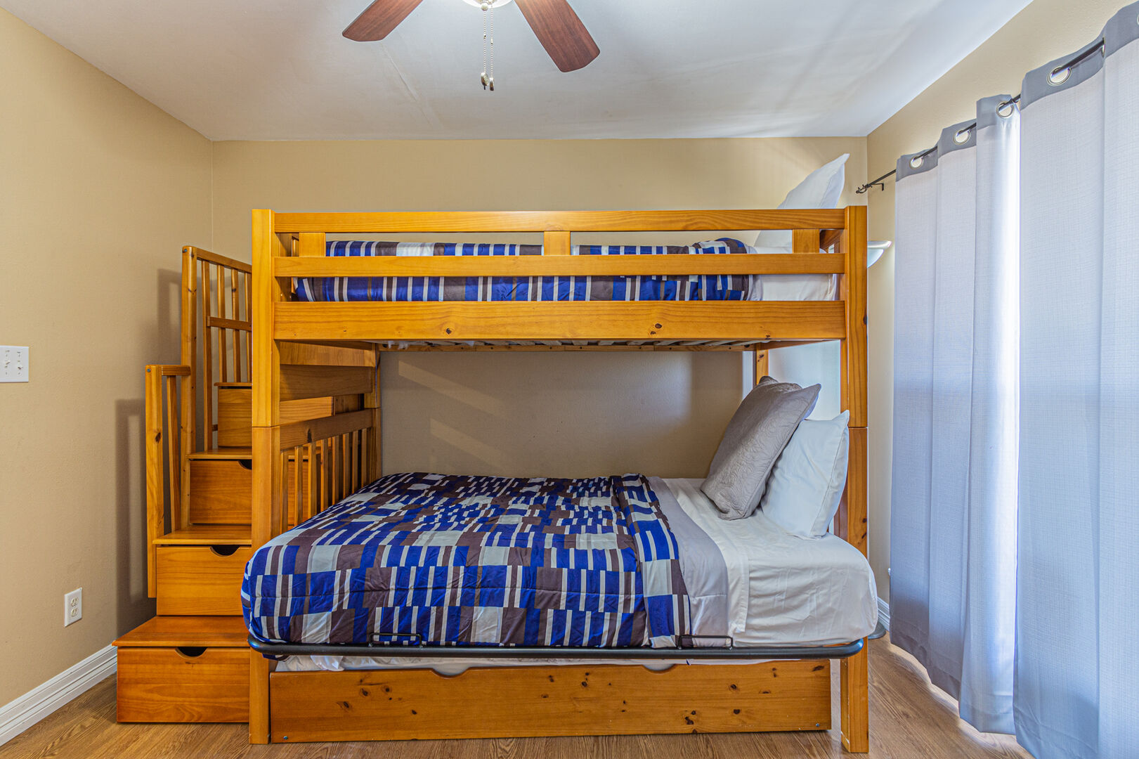 Second bedroom with twin size top bunk and full size trundle bed